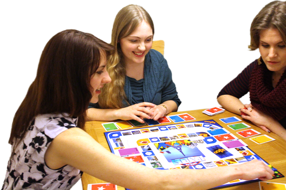Adults playing board game to learn French